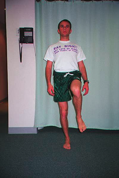 Dr. Ezgur performing Short Foot Single Leg Balance exersise