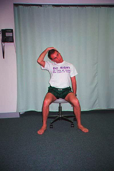 Dr. Ezgur performing Upper Trapezius PIR / Self Stretch exersise